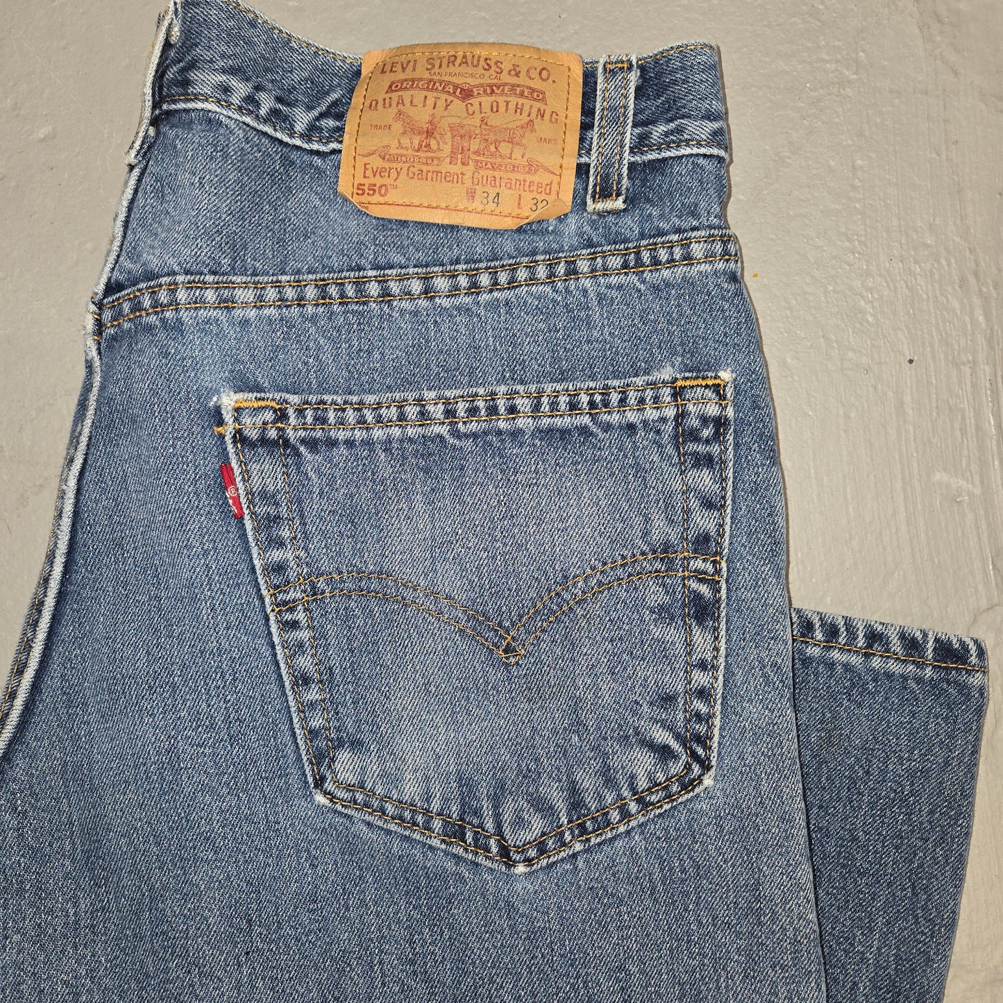 Vintage 1990s Levis 550 Distressed tab jeans 34x32 made in usa